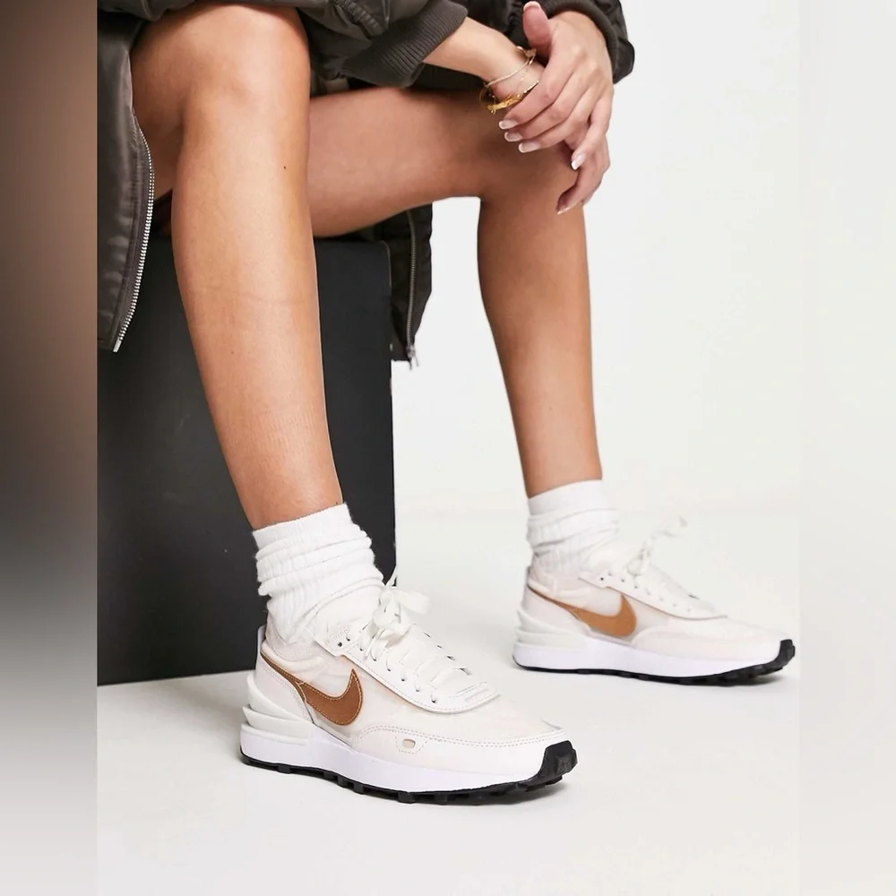 Nike Women's Sneakers in White with Metallic Rose Gold Swoosh